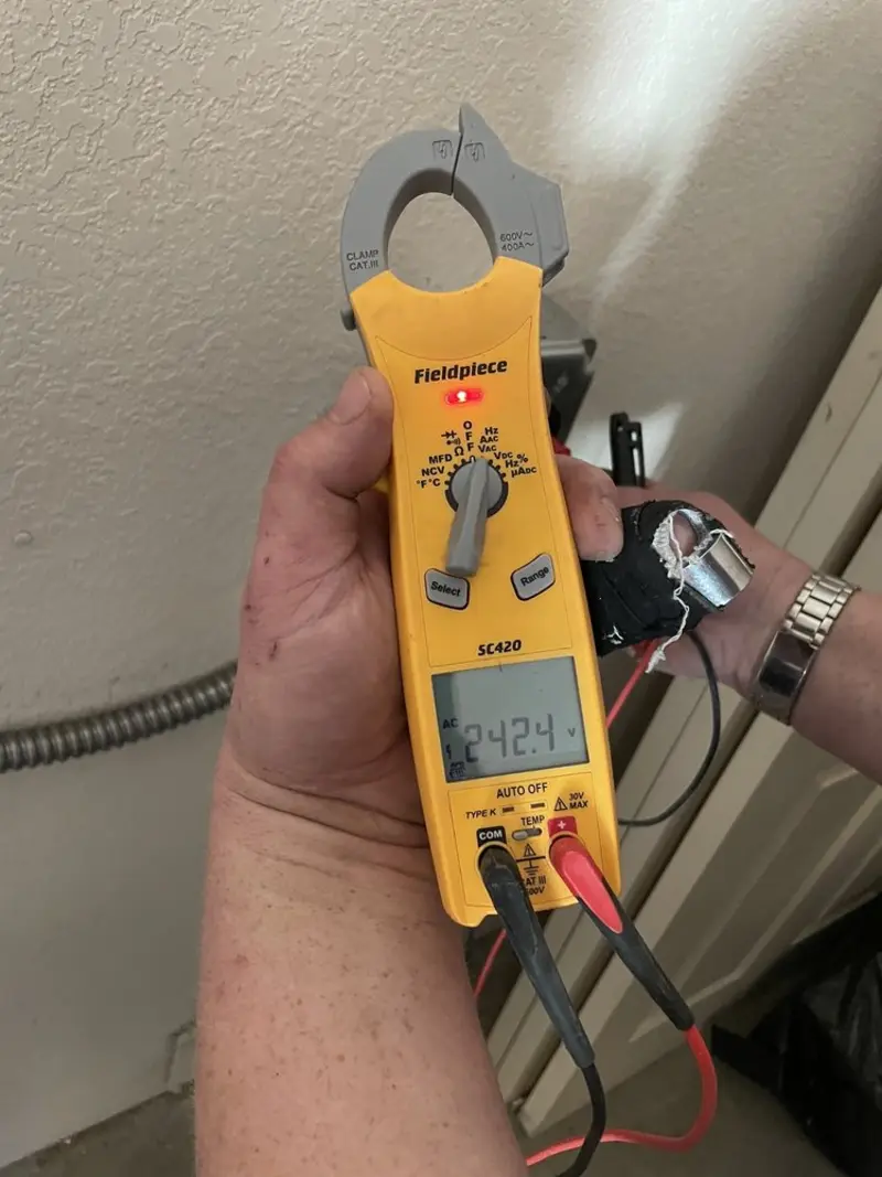 Voltage testing with clamp meter during Generator Installation in Charter Oak